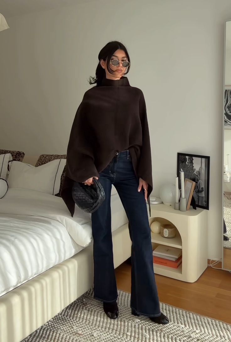 20 Cape Outfit Ideas That Look Straight Off the Runway (Wait Until You See #7!) - 15. Relaxed Espresso Poncho with Flared Jeans 1