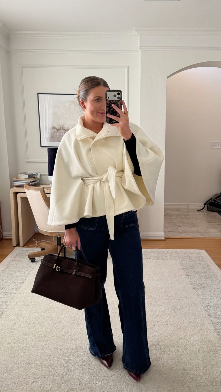 20 Cape Outfit Ideas That Look Straight Off the Runway (Wait Until You See #7!) - 4. Soft Ivory Cape with Dark Denim 1