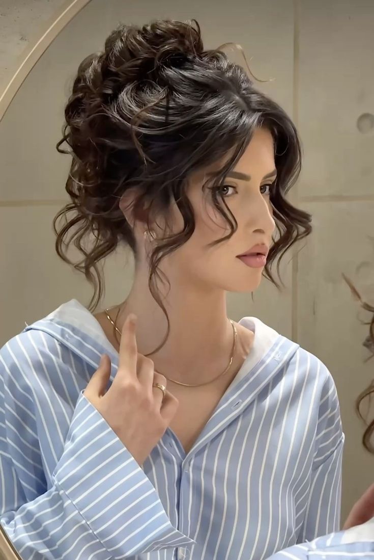 20 Elegant Messy Updos That Are Perfect for Prom, Parties, and Special Events - 2. The Romantic Curly Halo Bun 1