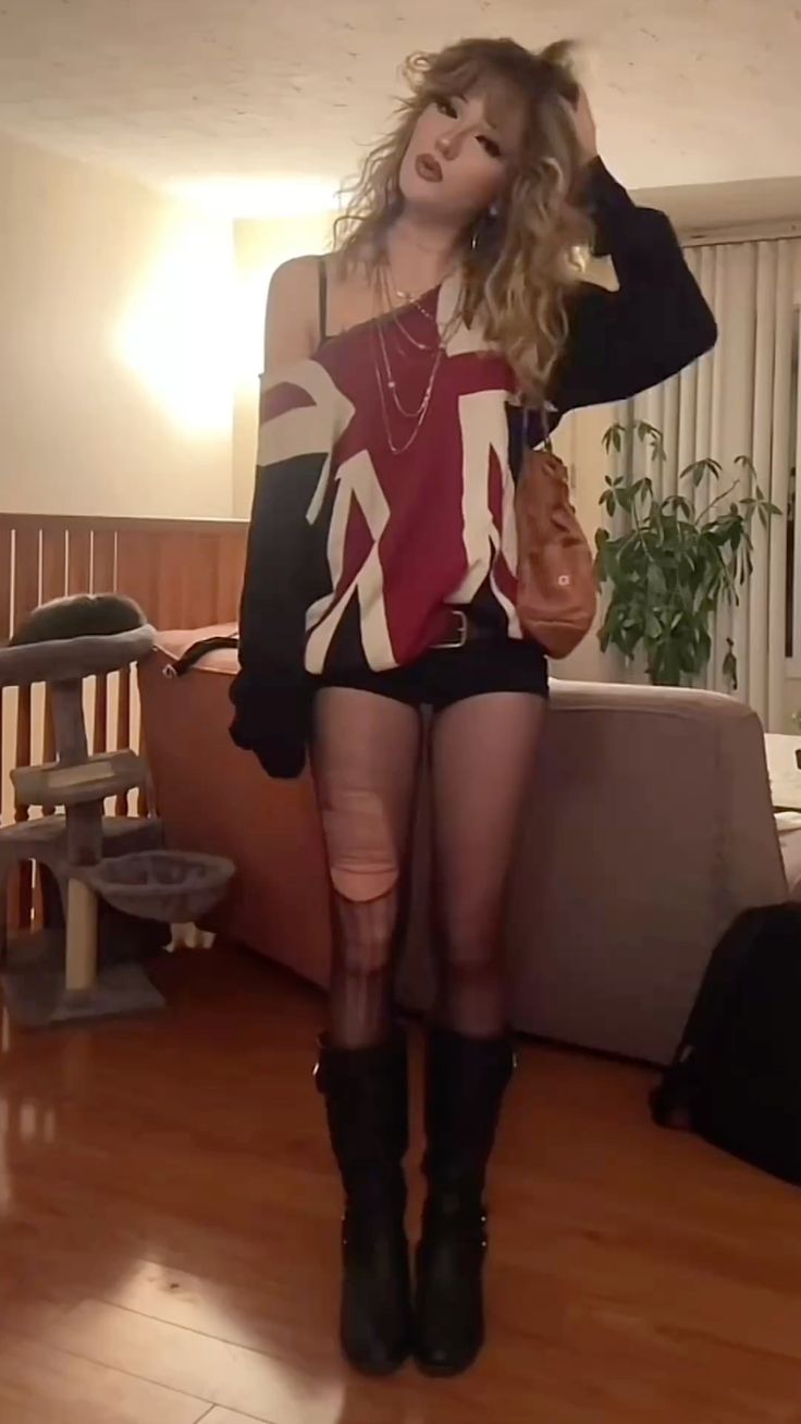 20 Indie Sleaze Outfits That Make Messy Look Magnificent - 18. Oversized Varsity Sweater and Barely-There Shorts 1