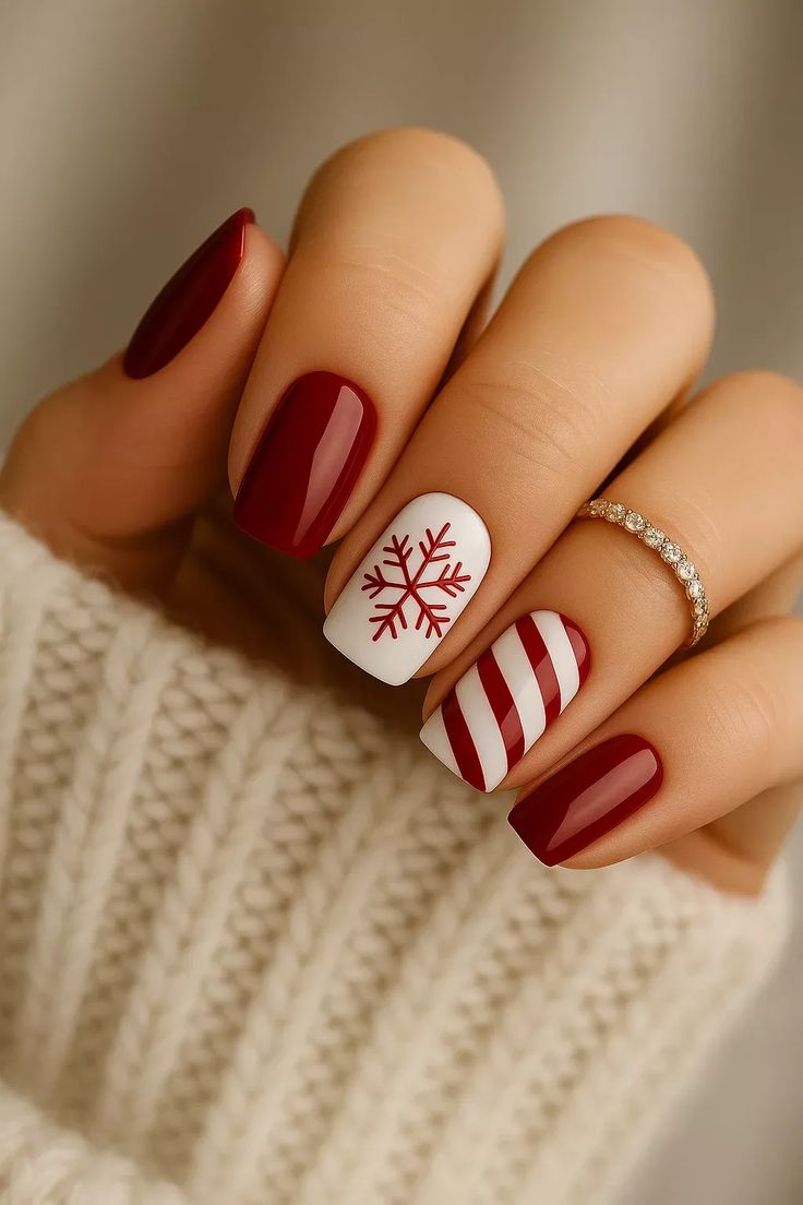 20 Stunning Winter Nail Designs That’ll Make Your Hands the Star of Every Holiday Party - 17. Candy-Cane Snowflake Contrast 1