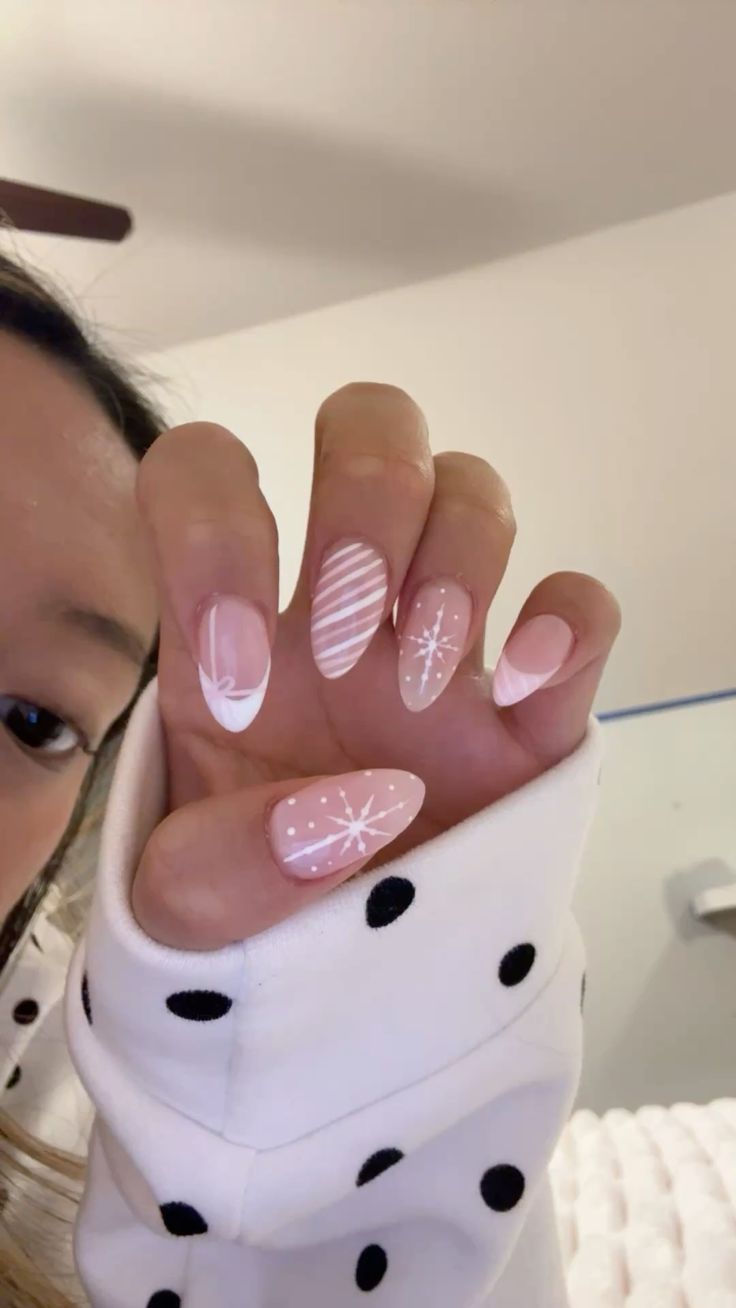 20 Stunning Winter Nail Designs That’ll Make Your Hands the Star of Every Holiday Party - 19. Blush Snowflakes and Soft White Lines 1