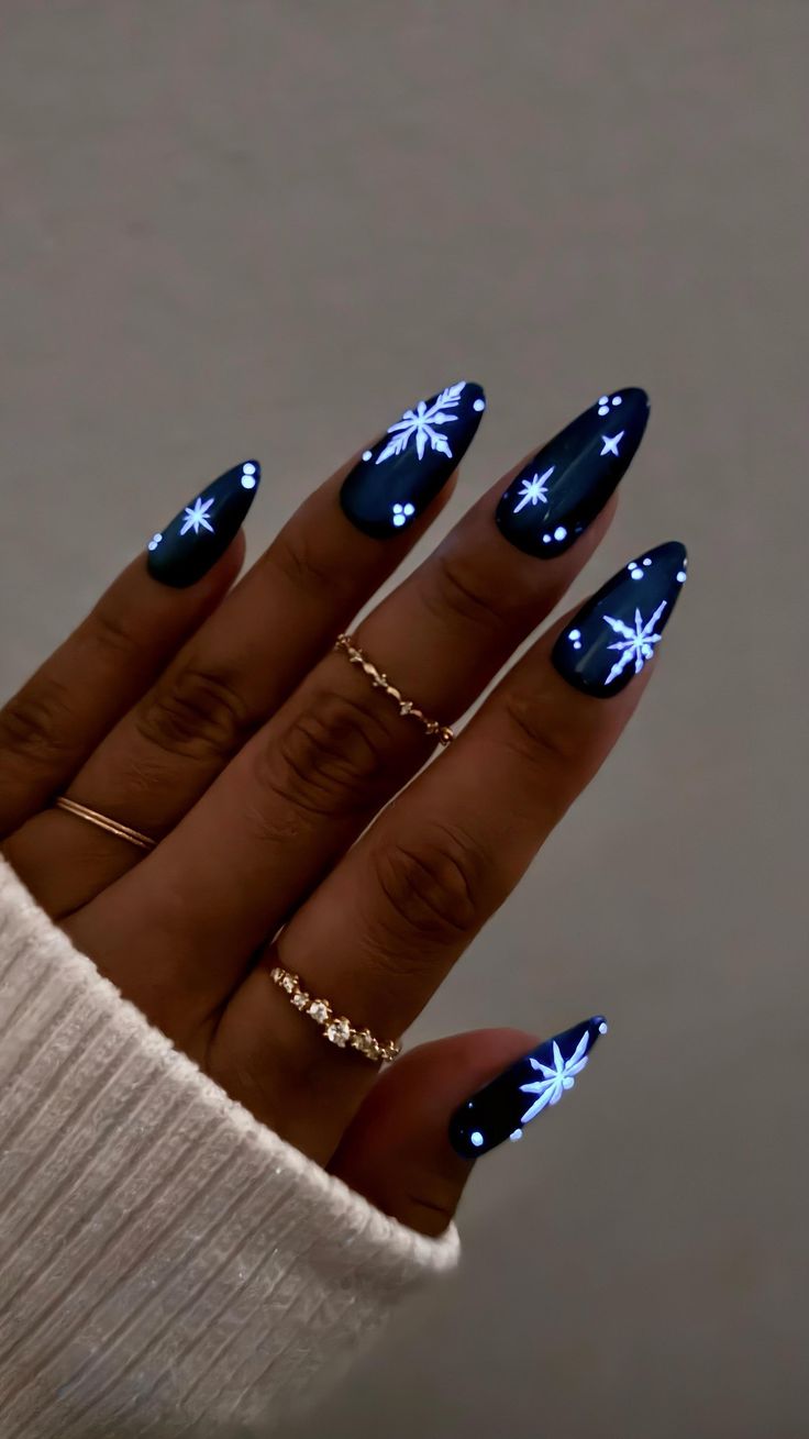 20 Stunning Winter Nail Designs That’ll Make Your Hands the Star of Every Holiday Party - 5. Midnight Glow Snowflakes 1