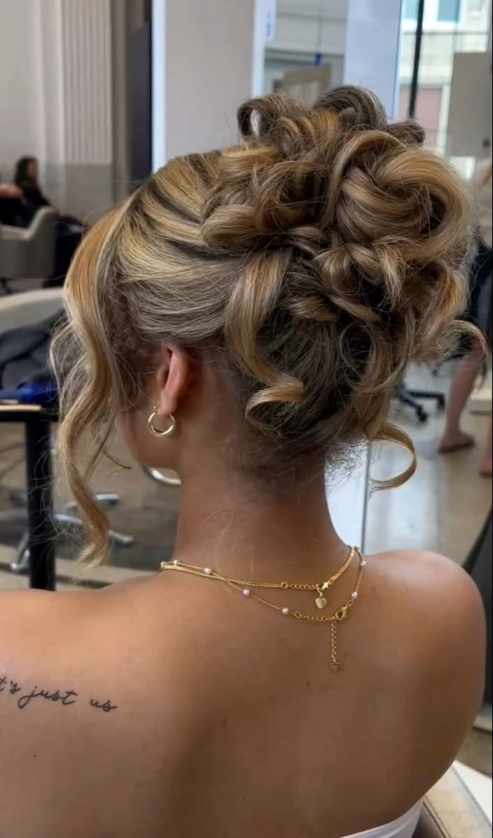 Christmas Hairstyles: 20 Easy Festive Updos and Waves - 20. Sculpted Holiday Flower Bun 1