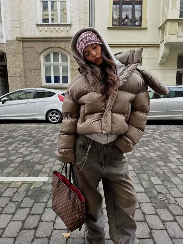 Puffer Jacket Outfits: 20 Ways to Look Chic in the Cold - 14. Oversized Taupe Puffer with a Patterned Beanie 1